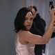 Tessa Thompson holds a gun with her hands in the air on Westworld.